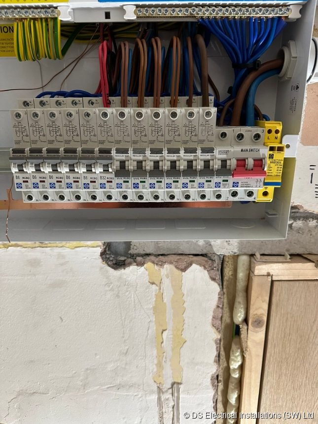 Consumer unit populated with individual RCBOs and a surge protection device, installed by DS Electrical Installations (SW) Ltd