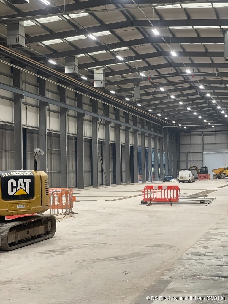 High bay LED lighting in a steel frame distribution warehouse, installed by DS Electrical Installations (SW) Ltd