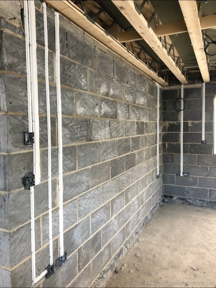 First fix conduit and cabling runs on a blockwork wall, installed by DS Electrical Installations (SW) Ltd