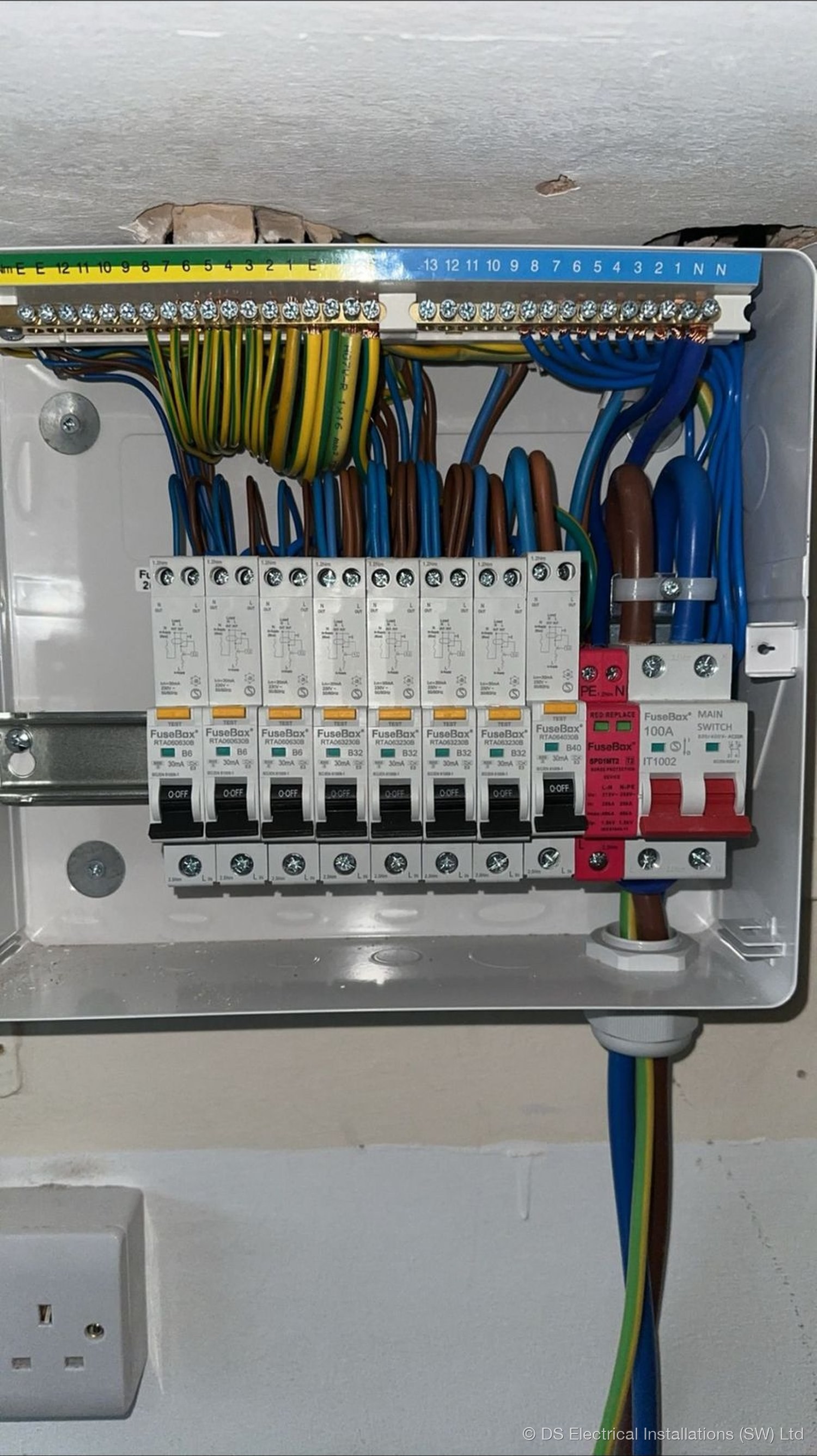 Consumer unit during commissioning with neatly dressed cables and labelled RCBO ways