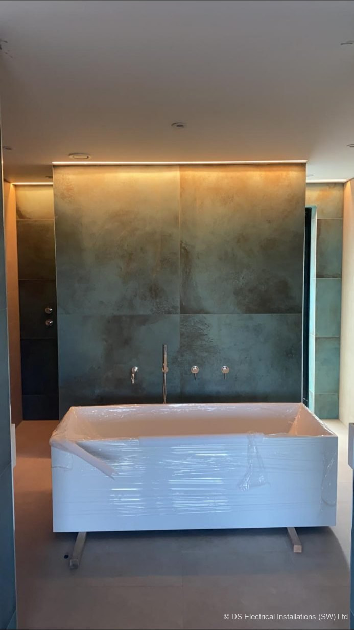 Concealed LED strip & wall-mounted taps