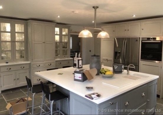 Shaker kitchen island with dome pendant lights and integrated appliances, wired by DS Electrical Installations (SW) Ltd