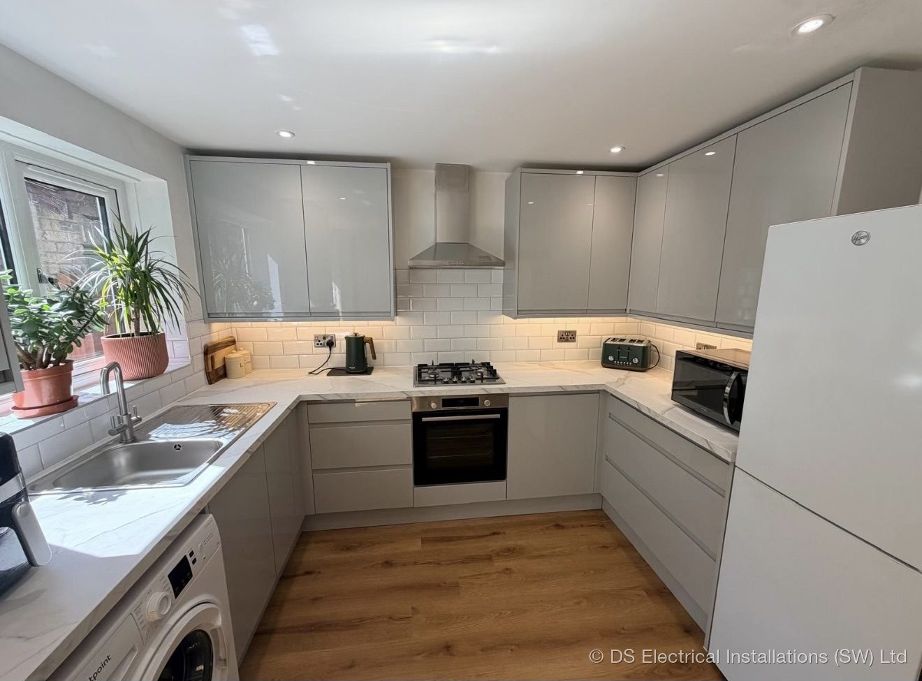 Completed grey handleless kitchen in Shepton Mallet rewired by DS Electrical Installations