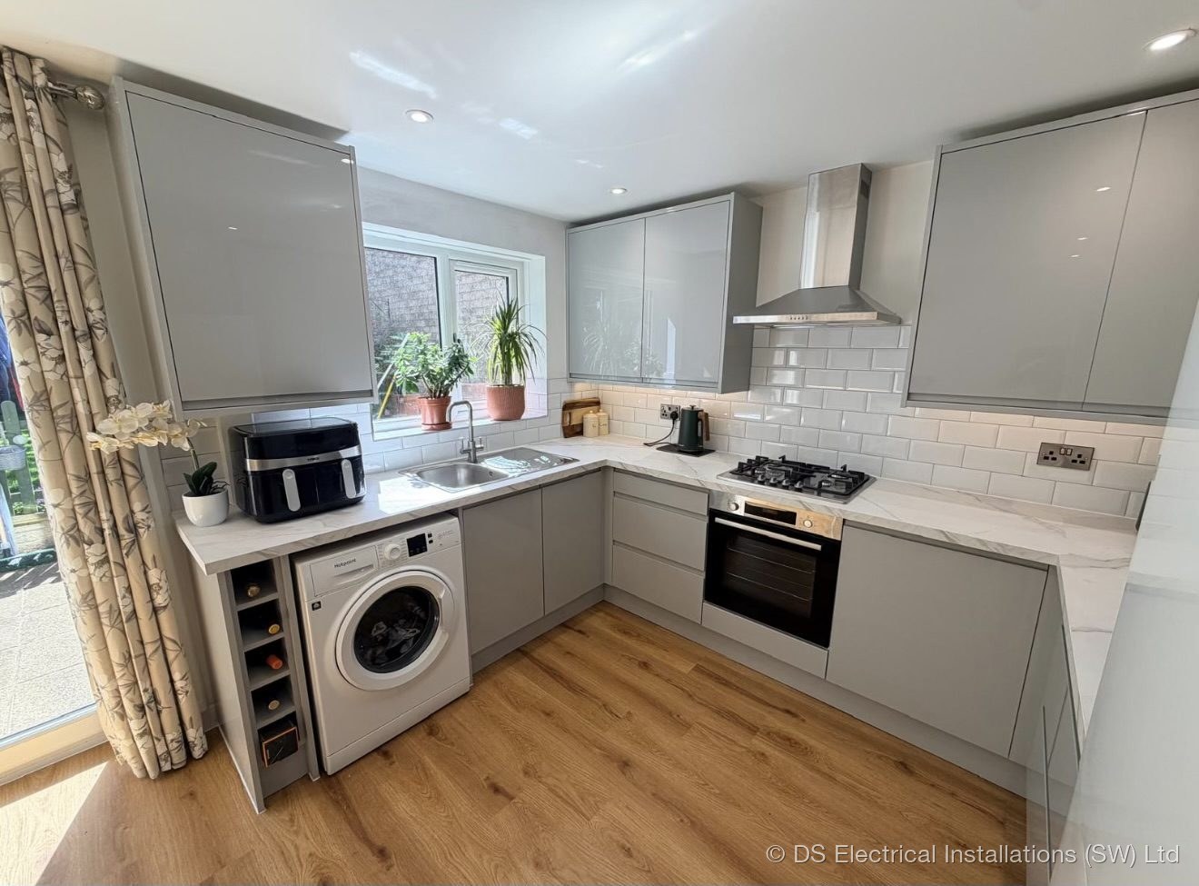 Grey gloss kitchen in Shepton Mallet wired for hob, oven, extractor and appliance circuits