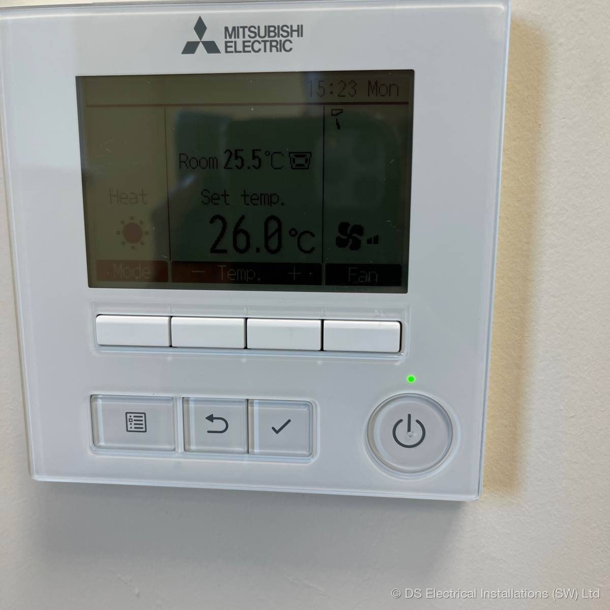 Mitsubishi Electric wall mounted air conditioning controller showing room and set temperature