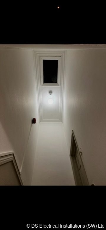 Stairwell ceiling with a downlight above the stairs